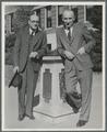 U. G. Dubach and Frank Magruder standing next to the sundial outside Commerce Hall