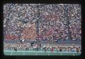 Oregon State Beavers football team on sideline with marching band in stands, Parker Stadium, Corvallis, Oregon, 1975