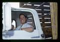 Pea harvester driving truck, Umatilla County, Oregon, 1974