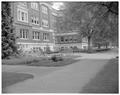 Flower garden and benches on south side of Home Economics Building, May 1959