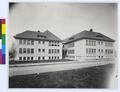 Hawthorne School on Alder St., Portland. Wood building with street and grass in foreground. (recto)