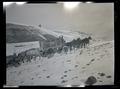 Line of elk crate wagons in the snow