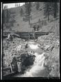 Men standing on spillway