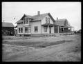 P. M. Spootstra house, Granger, WA. Wood, gabled house in front of barn. Other house in background.