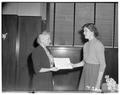 Margaret Fincke, Home Economics, presents Borden scholarship in home economics to Sherrill Carlson, Spring 1953