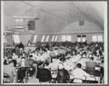 Men eating in the Quonset hut cafeteria