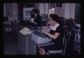 Louisa Odell at desk with typewriter, Oregon State University, Corvallis, Oregon, circa 1973