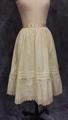 Petticoat of ivory wool with tucks and a flounce at the hem