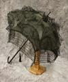 Parasol of black cotton with three long flounces of striped net