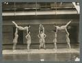 Women's gymnastic team in a gymnastic formation, circa 1930s