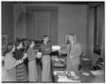 Don Van Allsburg, student body president, and other student leaders presenting a cake to President Strand on his birthday.