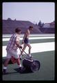 Workers laying astroturf in Parker Stadium, Oregon State University, Corvallis, Oregon, cica 1969