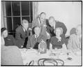 Pete Elliott, Kip Taylor, and Bump Elliott group around President Ruthven of the University of Michigan at alumni dinner, March 1950