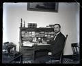 E.E. Wilson sitting at his law office desk