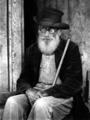 Elderly man with beard, and glasses