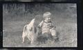 Child playing with Pete the dog