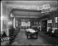 Interior of lounge, Elks Temple, Portland. Large table in center of room, chairs around edges.