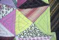 Triangle quilt, close up showing embroidered quilting
