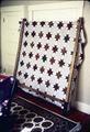 Quilt on frame, found in hotel and presumably used by former owner
