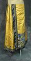 Skirt of yellow silk satin with trim of black satin, ribbon appliqué, and embroidered borders