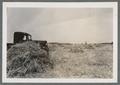 Truck in cut hay field