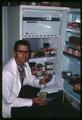 Dr. William Stephen and leaf cutter bees in straws in refrigerator, 1964