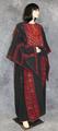 Woman's best dress of heavy black linen embroidered in red silk with accents