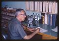 Dr. Paul Ritcher sitting at desk, circa 1965