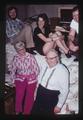 Doug Robins, Lynn Anne Herring, and Don Toevs sitting on bags of pennies with Mrs. Robins and Fred Robins, Halsey, Oregon, 1974