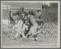 M. Anderson, OSC quarterback, shown with ball after intercepting C. Beale pass, 1945