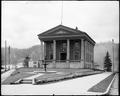 City Hall at St. John's, OR. Columns on front of building, fountain in foreground.