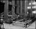 Interior view of Forestry Building on Lewis & Clark Exposition site, with close-up of displays of stuffed animals and natural habitat.