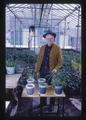 Gene Gross with potatoes in recently drained Klamath marsh soil, Klamath Agricultural Experiment Station, Klamath Falls, Oregon, 1967