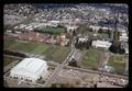 Aerial view of Oregon State University and Corvallis, Oregon -- Gill Coliseum, Bell Field and Recreational Sports fields in the foreground, April 7, 1969