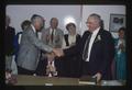 Jean Popovich shaking hands with Walther Ott at College of Agriculture event, Oregon State University, Corvallis, Oregon, June 19, 1995