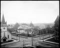 View from above intersection, 11th and Willamette, Eugene, OR., showing First Christian Church, Catholic Church, and First Methodist Episcopal Church. Public Library on foreground corner. House in background.