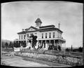 Good Samaritan Hospital at Marshall St., Portland. Surrounding fence and wooden street in foreground.