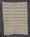 Convent Sampler of natural colored linen or cotton with a variety of open-work embroidered designs