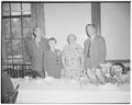 Two dormitory employees, Mrs. Tuller and Mrs. Sid Scholoeman, are honored on their retirements by President Strand and Robert Koehler, dorm director, May 31, 1950