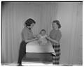 Home Economics students with Mark, a Withycombe House "practice baby," December 1953