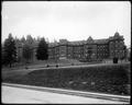 Front view, St. Vincent's Hospital, Portland. Hospital walls, retaining wall in foreground.