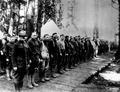 Men lined in camp