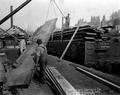 Loading Spruce Lumber on Rail Car.