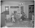 Home Economics student working with children at Park Terrace day school, December 1955