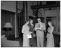 Ted Yerian (Secretarial Science) looks at his notes with other participants in a Summer Session open house, Memorial Union