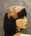 Cap of warm caramel colored iridescent sequins with edges trimmed in taupe velvet pipe