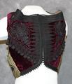 Vest of wine red velvet heavily embellished with braided black cord embroidery and applique