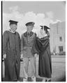 Slats Gill (left), an unidentified individual and Gill's daughter Jane on commencement day, June 4, 1956