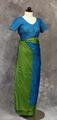 Sari of bright blue silk with olive green border finished with net knotted weave and olive green tassels