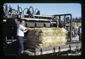 Richard L. Ferris with super density straw baler, Hastro West, Oregon, circa 1973